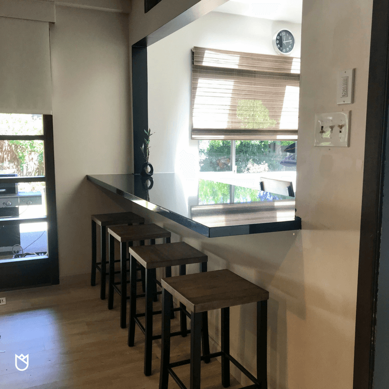 Because we didn’t remove a wall, we chose instead to create a bar seating area by making a pass-through to the great room. This was accomplished by cutting a hole in the wall