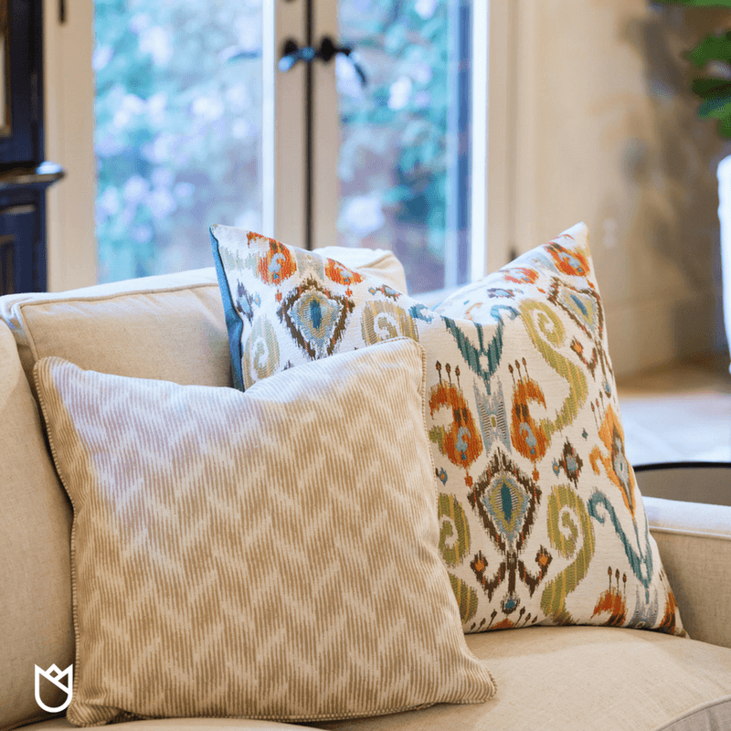 Ikat prints and geometric patterned pillows dress out this sectional