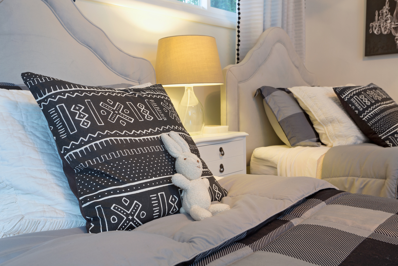 girls-bedroom-design-accent-pillows-stuffed-rabbit
