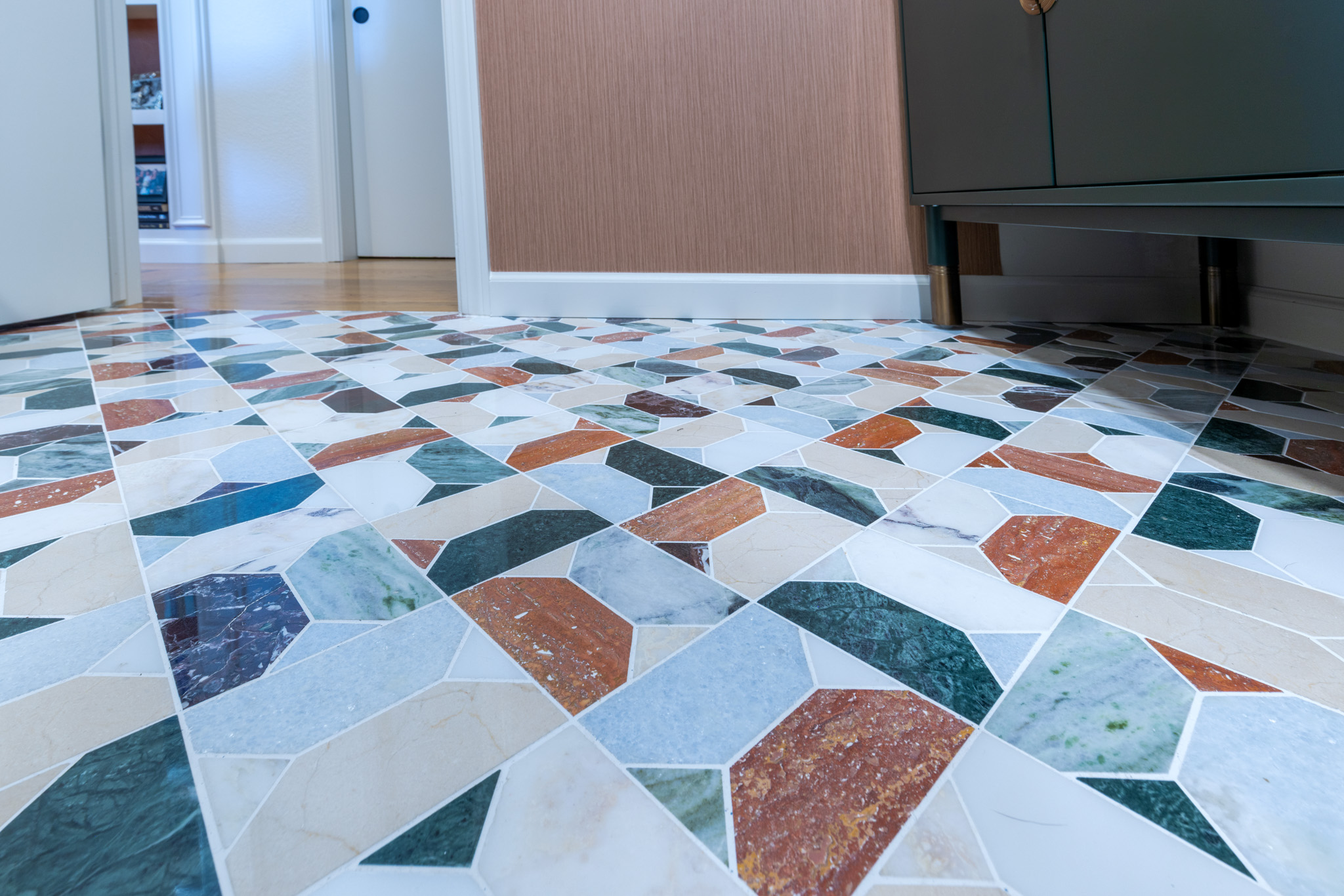 ktj-design-co-close-up-of-marble-mosaic-floor-in-forest-inspired-bathroom-remodel-featuring-green-terracotta-white-stone-95236-ho9a0217-2-2