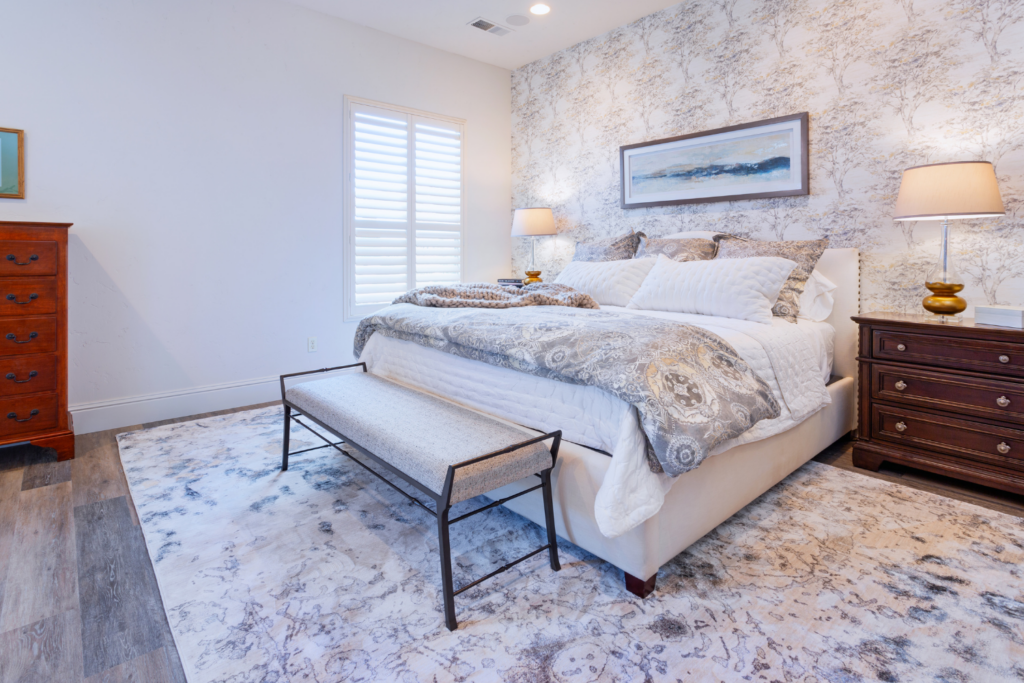 Bedroom Gray And Beige Wallpaper Bench Upholstered Headboard Artwork Side Tables Lamps