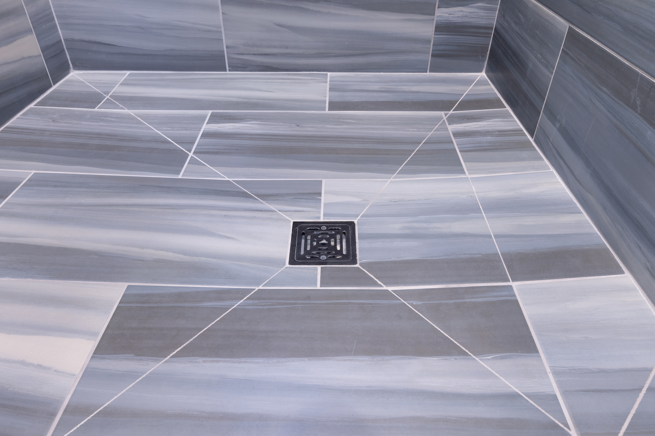 tile-shower-floor-black-drain-gray-tile