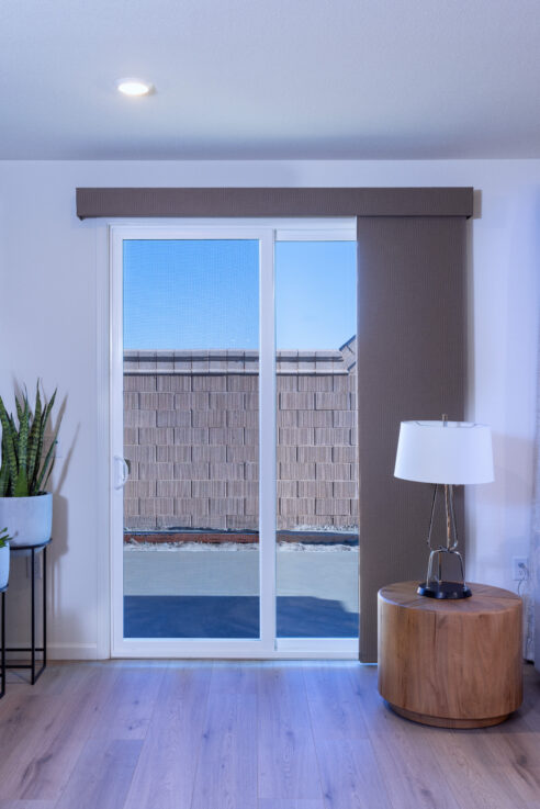 great-room-living-room-sliding-door-track-panel-window-coverings-solar-shade-95212-interior-design_ho9a8143