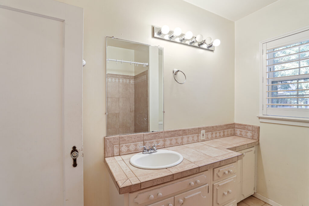 how smart space planning transformed  dated bathrooms