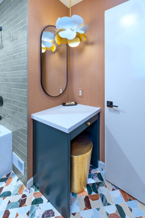 ktj-design-co-custom-makeup-vanity-nook-in-forest-inspired-bathroom-remodel-with-green-cabinetry-brass-stool-terracotta-wallpaper-95236-ho9a0145-2