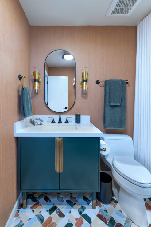 ktj-design-co-guest-bathroom-remodel-with-marble-mosaic-floor-terracotta-wallpaper-green-cabinetry-and-white-tub-shower-95236-ho9a0163-2