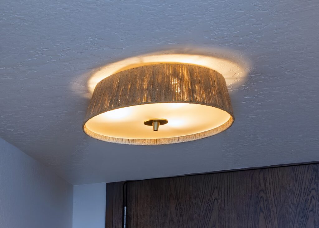 Santa Cruz Coastal Condo Entry With Flush Mount Woven Ceiling Light And Soft Ambient Glow