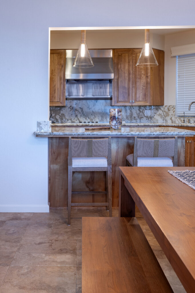 Santa Cruz Condo Kitchen With Glass Pendant Lighting And Natural Wood Cabinetry