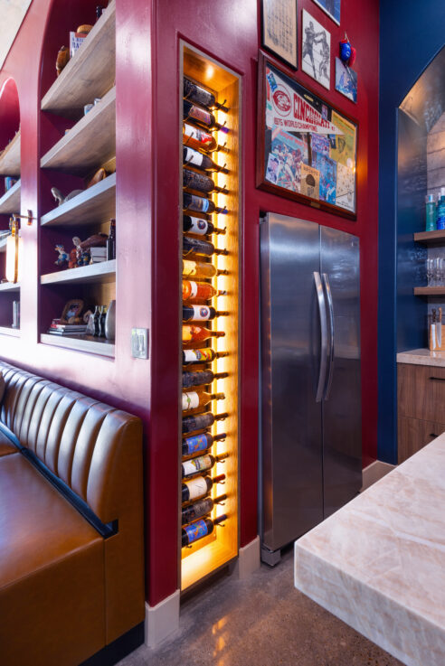 morada-ktj-design-co-gameroom-bar-wine-boxing-49er-red-arched-built-in-bookshelves-polished-concrete-bench-seating_ho9a1417
