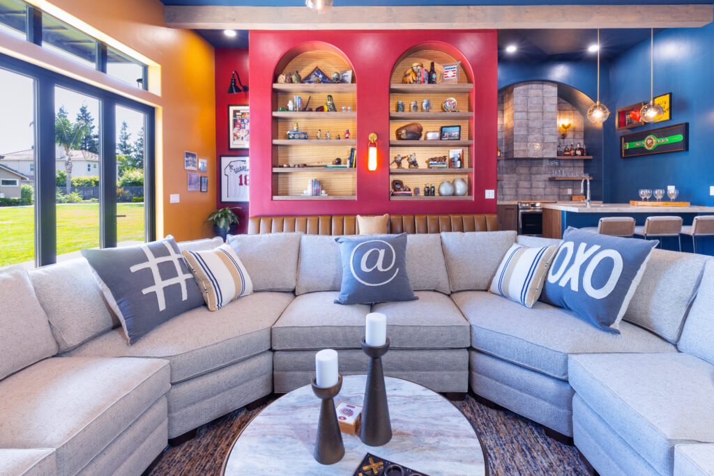 Morada Ktj Design Co Gameroom Built In Arched Bookcases Gold Wallpaper Folding Door Large Sectional Dark Ceiling Wood Beams Bar Kitchen Ho9a1386