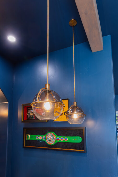 morada-ktj-design-co-gameroom-sports-bar-ombre-pendants-gold-wood-beams-boxing-dark-navy-blue-ceiling-walls_ho9a1579