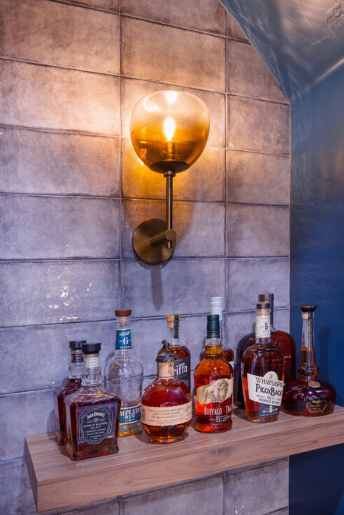 morada-ktj-design-co-sports-bar-gamroom-wall-sconce-ombre-glass-whiskey-shelf-wynnbooke-cabinetry-emser-tile-exhale-gris_ho9a1605