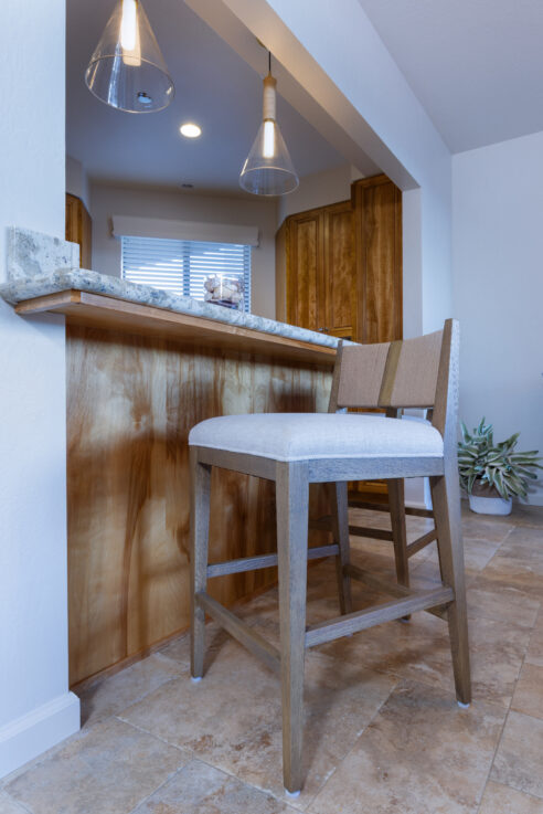 ktj-design-co-beach-condo-tide-line-kitchen-counter-stools-woven-rope-back-glass-pendants-rope_ho9a6539