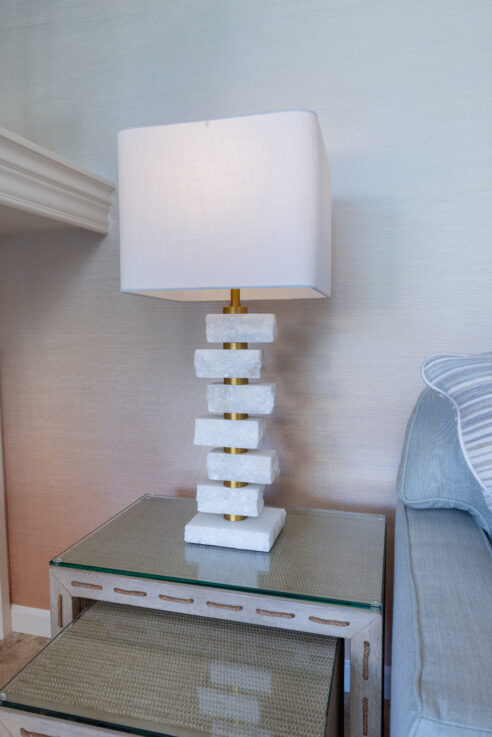 ktj-design-co-santa-cruz-beach-condo-living-room-marble-base-lamp-nesting-table-grass-cloth-wallpaper_ho9a6510