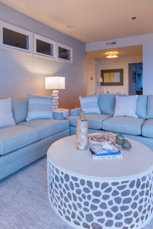 ktj-design-co-santa-cruz-beach-condo-tide-line-coastal-white-coral-metal-coffee-table-sunset-grasscloth-wallpaper-blue-sofa_ho9a6716