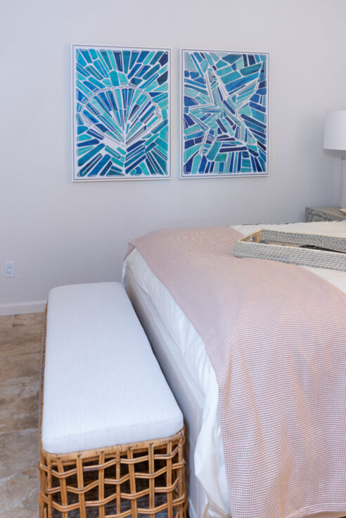 ktj-design-co-santa-cruz-beach-condo-tide-line-guest-bedroom-wicker-bench-shell-starfish-artwork-clay-quilt-crisp-bedding_ho9a6675