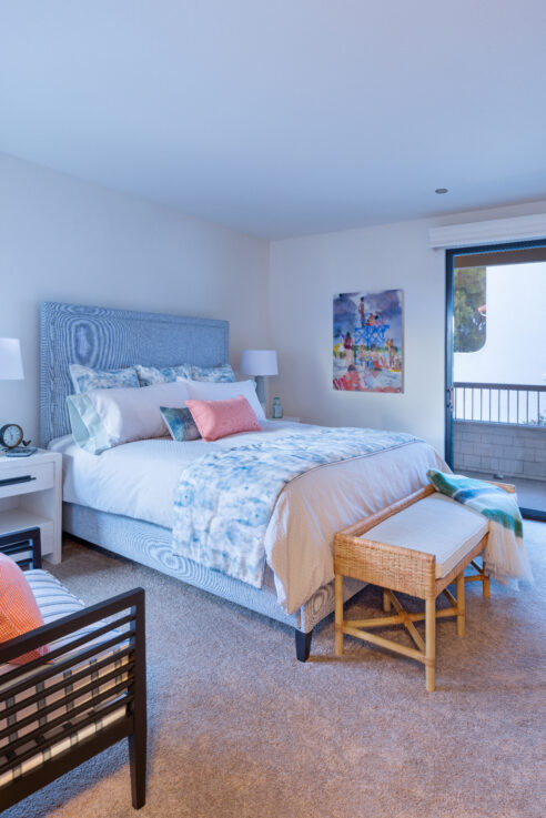 ktj-design-co-santa-cruz-beach-condo-tide-line-guest-bedroom-wicker-bench-upholstered-blue-bed-coral-pillow-crisp-bedding_ho9a6768