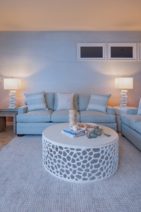 ktj-design-co-santa-cruz-beach-condo-tide-line-living-room-coastal-sunset-mirage-grass-cloth-wallpaper-white-coffee-table_ho9a6722