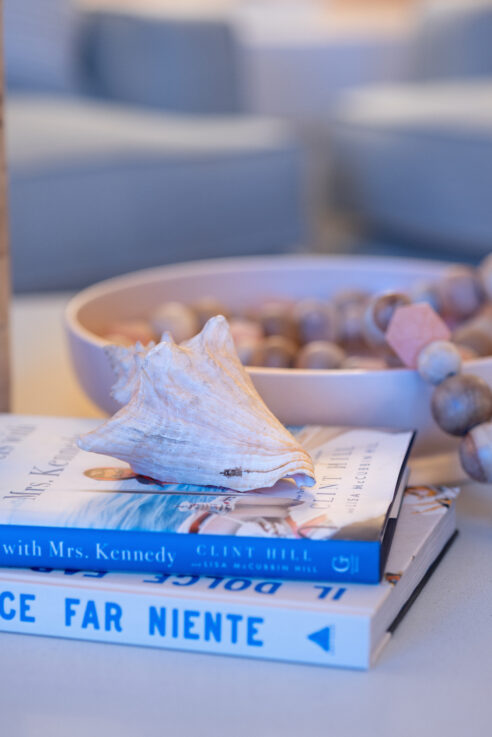ktj-design-co-santa-cruz-beach-condo-tide-line-living-room-coffee-table-decor-books-sea-shell-coral-beads-clay-bowl_ho9a6777-2