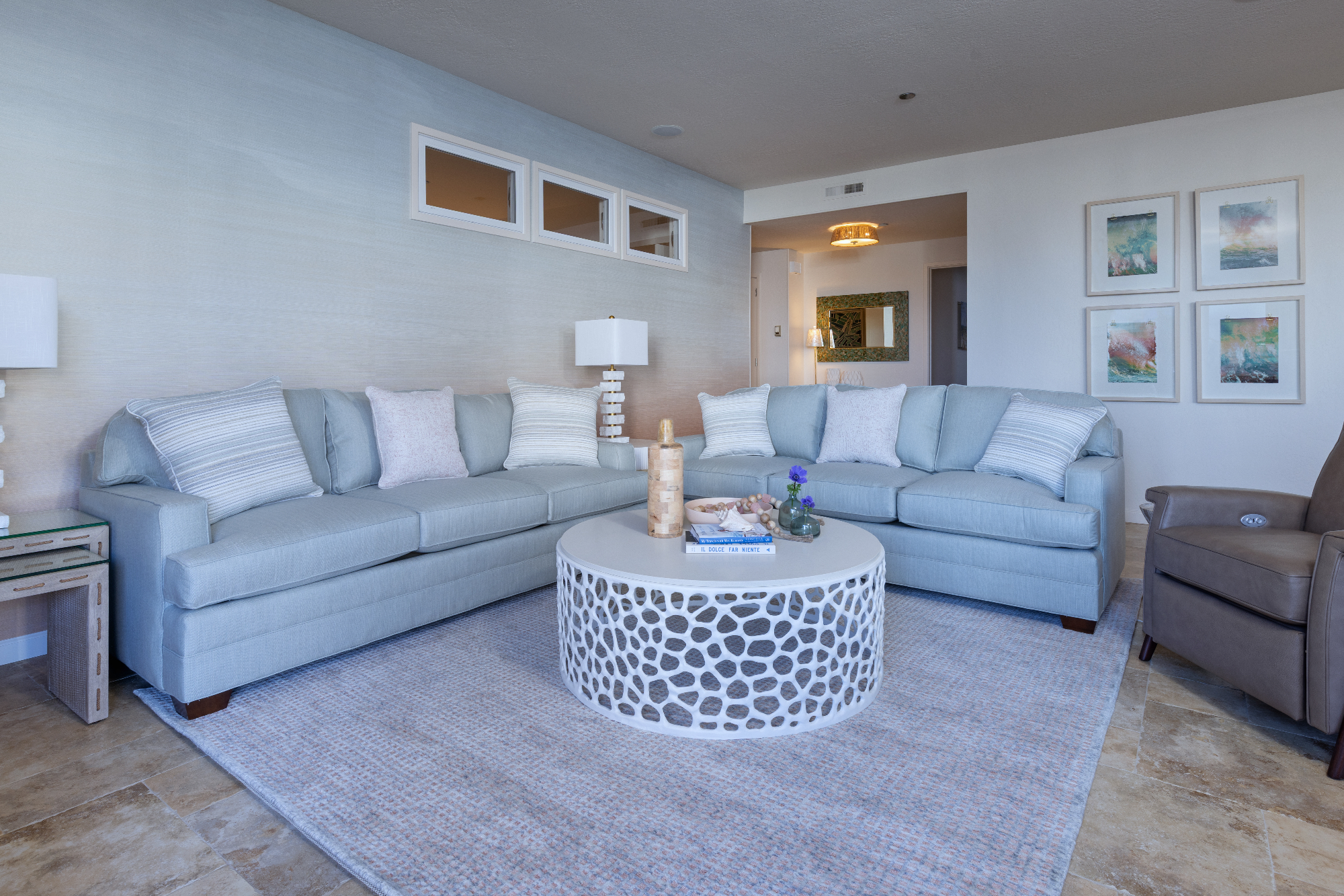 ktj-design-co-santa-cruz-tide-line-beach-condo-living-room-blue-green-sofas-coral-wool-area-rug-leather-recliner_ho9a6448